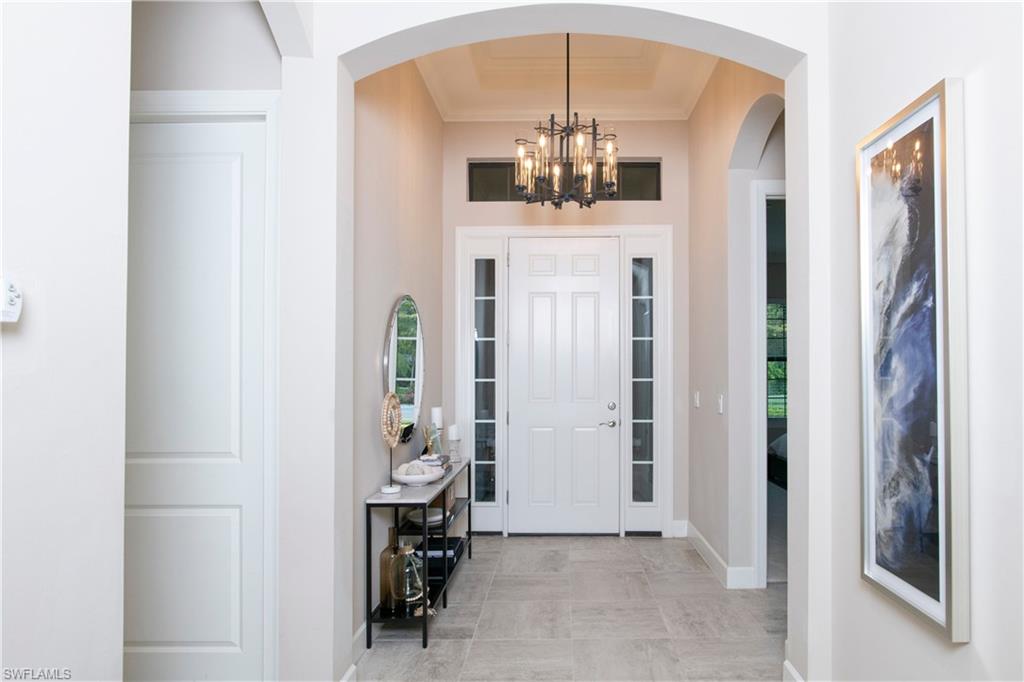 10179 Coconut Road Estero, FL 34135 - Photo 5 of 29 a view of dining room with chandelier