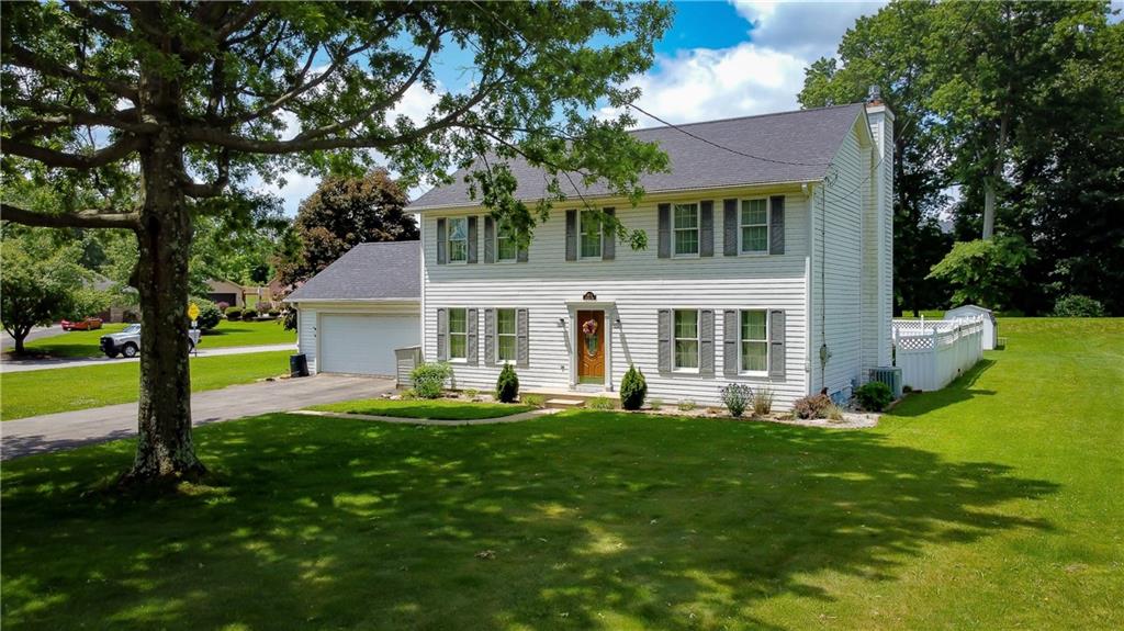 236 1/2 Meridian Road Butler, PA 16001 - Photo 1 of 24 a front view of a house with a yard and trees
