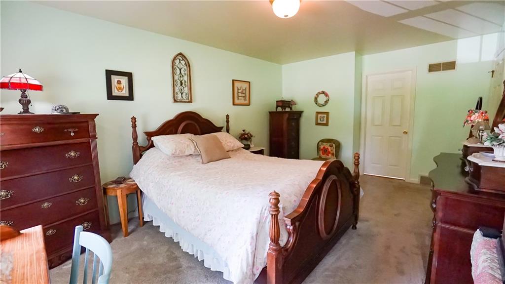 236 1/2 Meridian Road Butler, PA 16001 - Photo 12 of 24 a bedroom with a bed and a closet