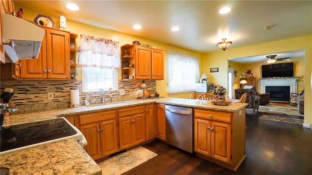 236 1/2 Meridian Road Butler, PA 16001 - Photo 3 of 24 a kitchen with stainless steel appliances granite countertop a sink and cabinets
