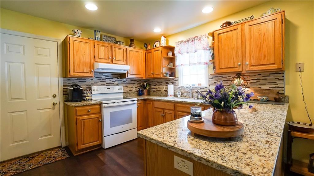 236 1/2 Meridian Road Butler, PA 16001 - Photo 5 of 24 a kitchen with sink refrigerator and stove