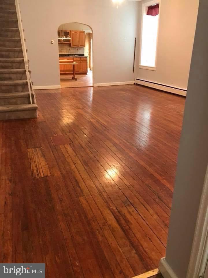 450 Seville Street Philadelphia, PA 19128 - Photo 5 of 14 an empty room with wooden floor