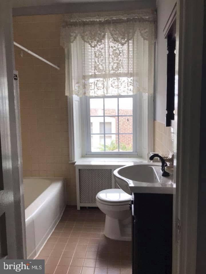 450 Seville Street Philadelphia, PA 19128 - Photo 7 of 14 a bathroom with a sink and a bathtub