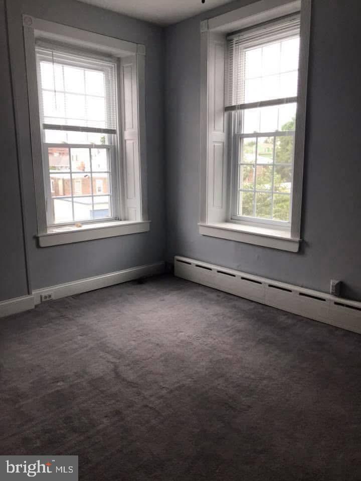 450 Seville Street Philadelphia, PA 19128 - Photo 8 of 14 an empty room with a window