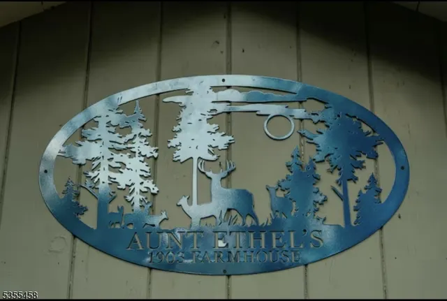 an aerial view of a dining room with table and chairs