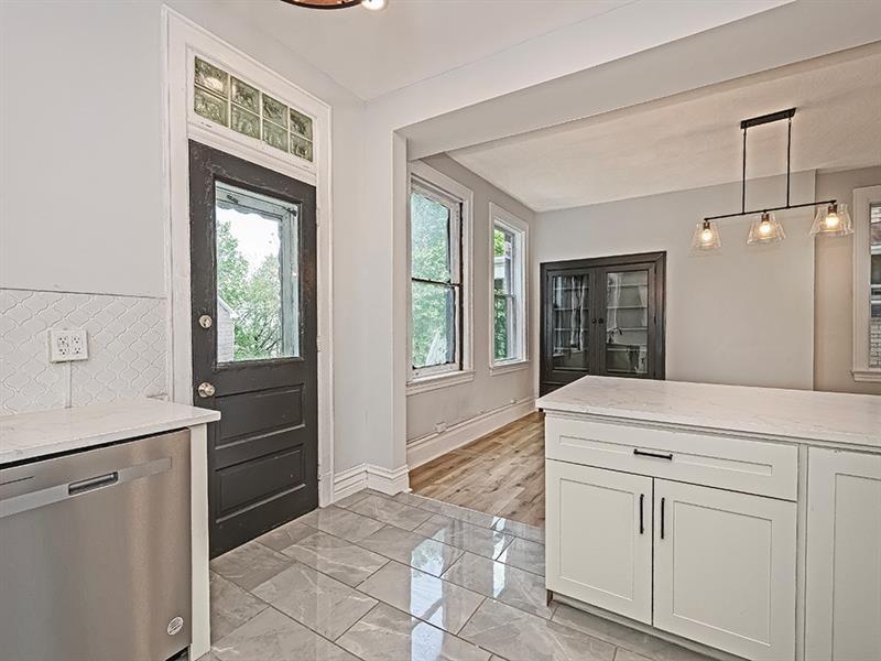 923 Adelaide Street Pittsburgh, PA 15219 - Photo 14 of 32 a room with a cabinets and a window
