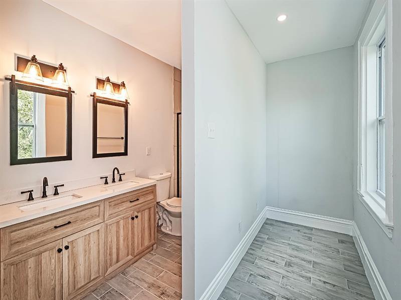 923 Adelaide Street Pittsburgh, PA 15219 - Photo 20 of 32 a bathroom with a sink and a mirror