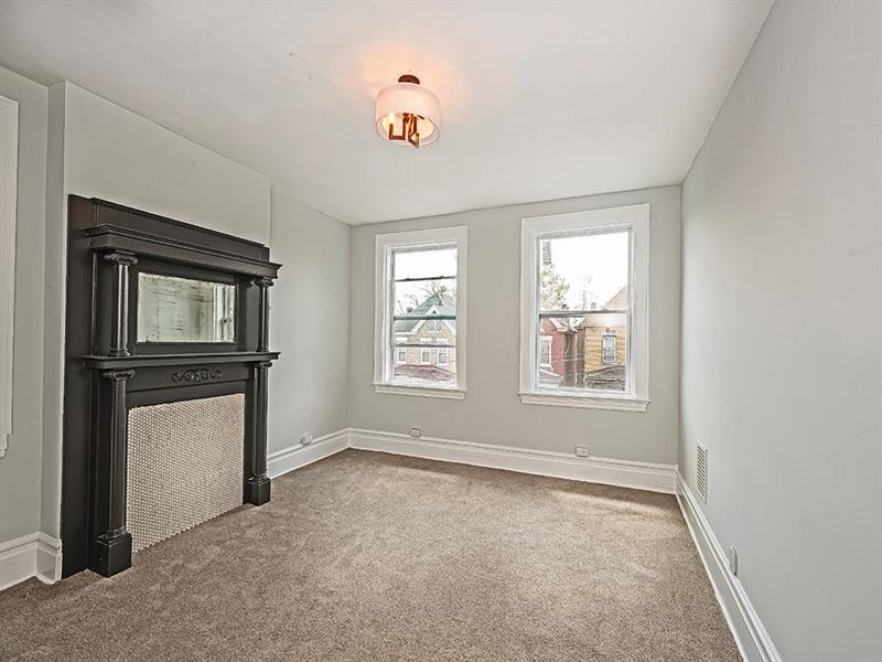 923 Adelaide Street Pittsburgh, PA 15219 - Photo 23 of 32 an empty room with windows and cabinet