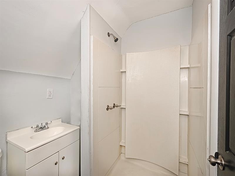 923 Adelaide Street Pittsburgh, PA 15219 - Photo 28 of 32 a bathroom with a sink toilet and shower