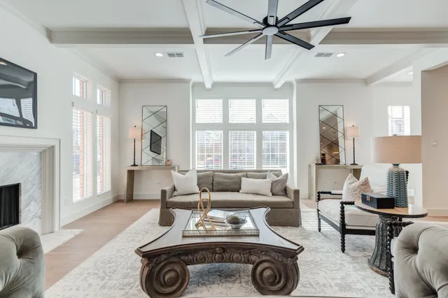 a living room with furniture and a lamp