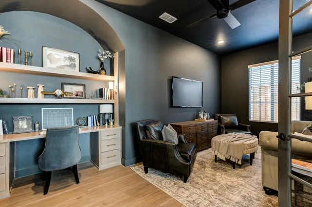 a stove top oven sitting inside of a kitchen