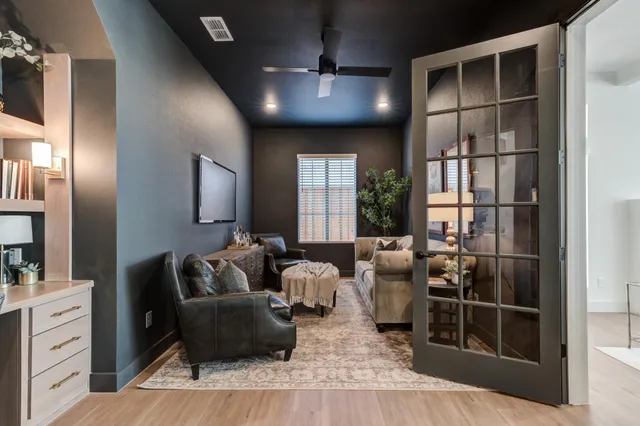 a kitchen with a stove a sink a dining table and chairs