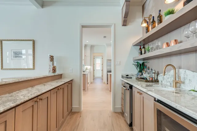 a kitchen with a table chairs cabinets and appliances