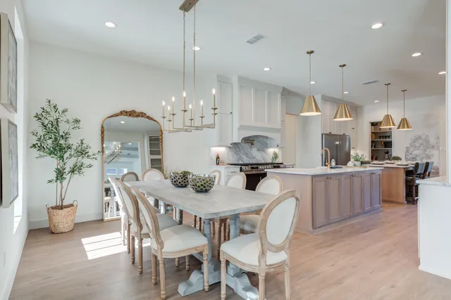 a kitchen with stainless steel appliances granite countertop refrigerator sink and cabinets
