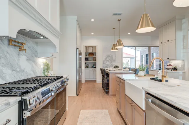 a bath tub sitting next to a white sink