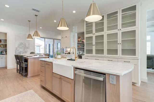 a bathroom with a sink vanity granite and a mirror