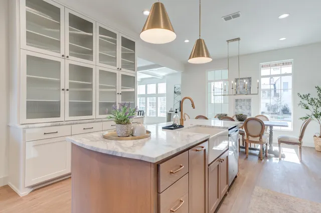 a kitchen with granite countertop a sink and a stove