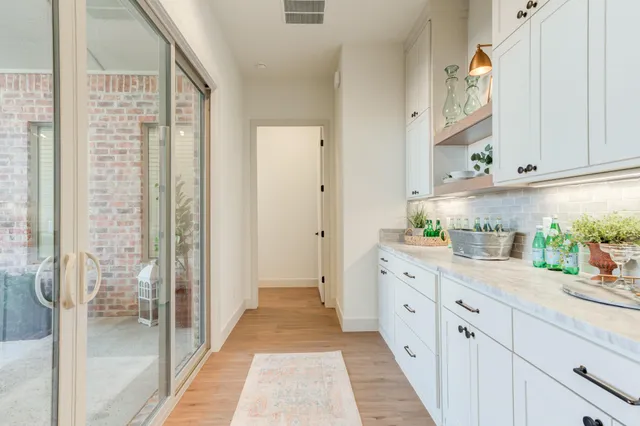 a view of a livingroom with furniture and a window