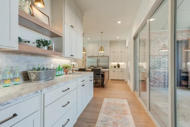a kitchen with cabinets a sink and appliances