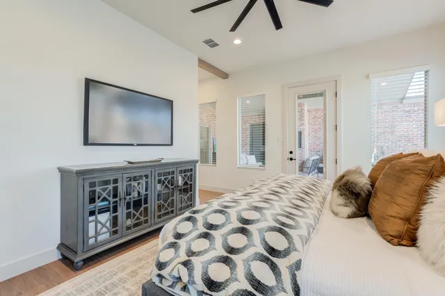 a outdoor living space with furniture and a flat screen tv
