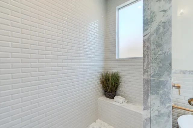 a view of a pathway with a wooden fence