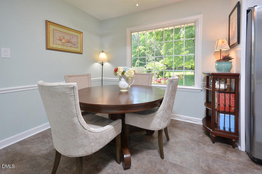 313 Andover Road Durham, NC 27712 - Photo 15 of 36 a view of a dining room with furniture window and outside view