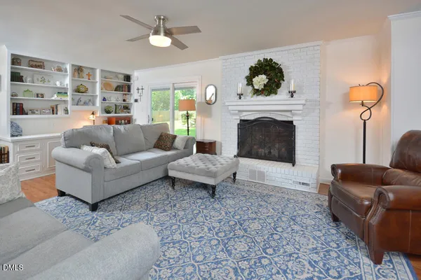 a living room with furniture and a fireplace