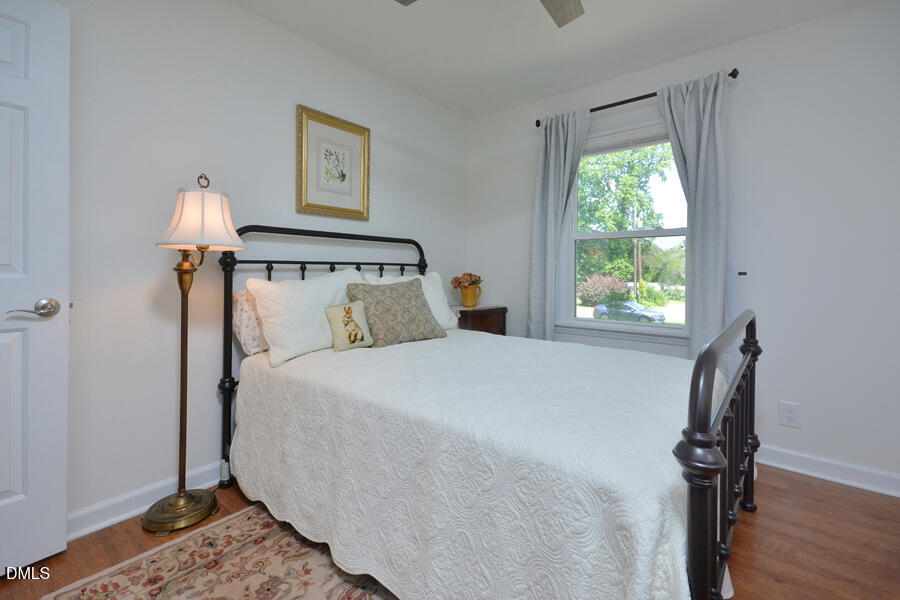 313 Andover Road Durham, NC 27712 - Photo 21 of 36 a bed sitting in a bedroom next to a window