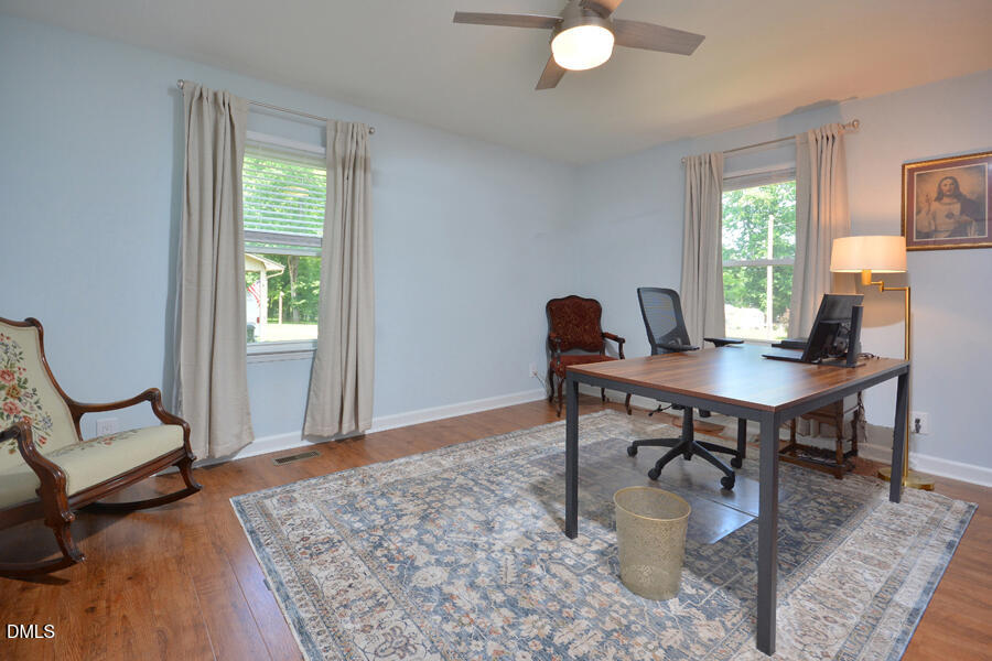 313 Andover Road Durham, NC 27712 - Photo 23 of 36 a view of a workspace with furniture and a window