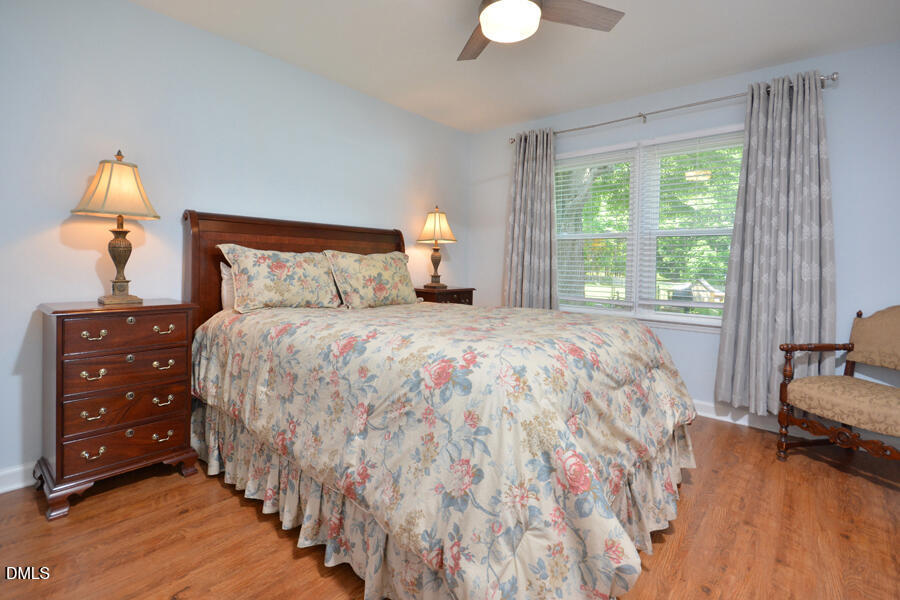 313 Andover Road Durham, NC 27712 - Photo 24 of 36 a bedroom with a bed and a dresser next to a window