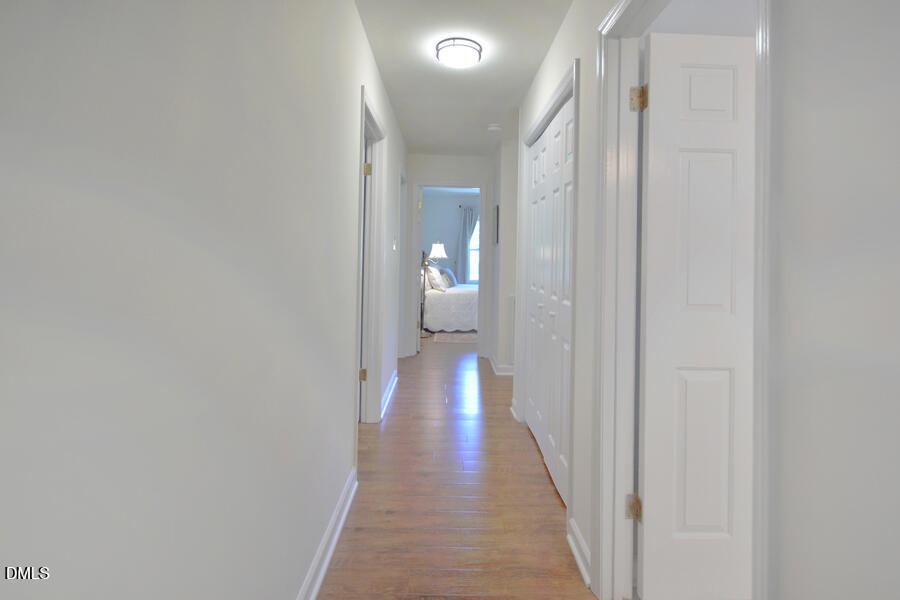 313 Andover Road Durham, NC 27712 - Photo 30 of 36 a view of a hallway with wooden floor