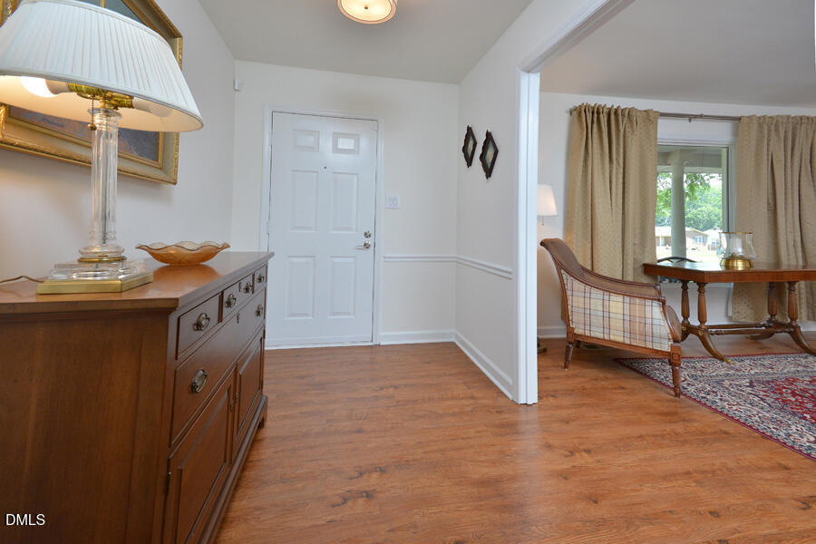 313 Andover Road Durham, NC 27712 - Photo 4 of 36 a bathroom with a sink a mirror and a shower