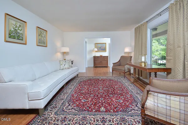a living room with furniture and a rug