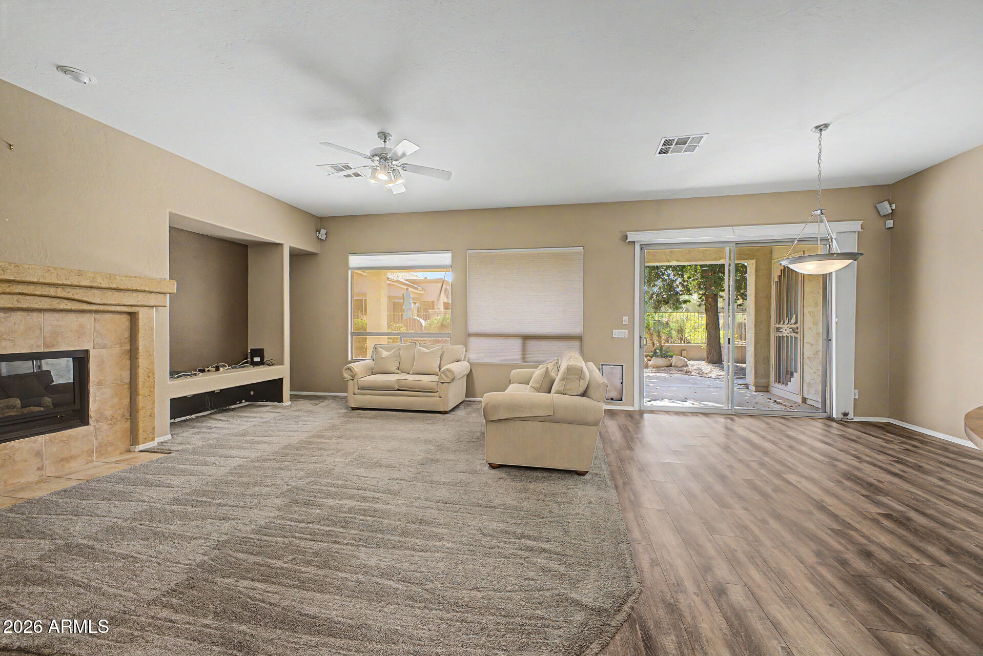 5090 South Ranger Trail Gilbert, AZ 85298 - Photo 4 of 50 a living room with furniture and a fireplace