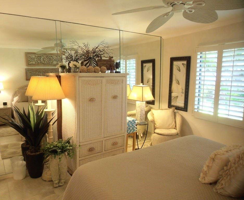12 South Kihei Road, Unit G5 Kihei, HI 96753 - Photo 19 of 28 a living room with a couch and chandelier