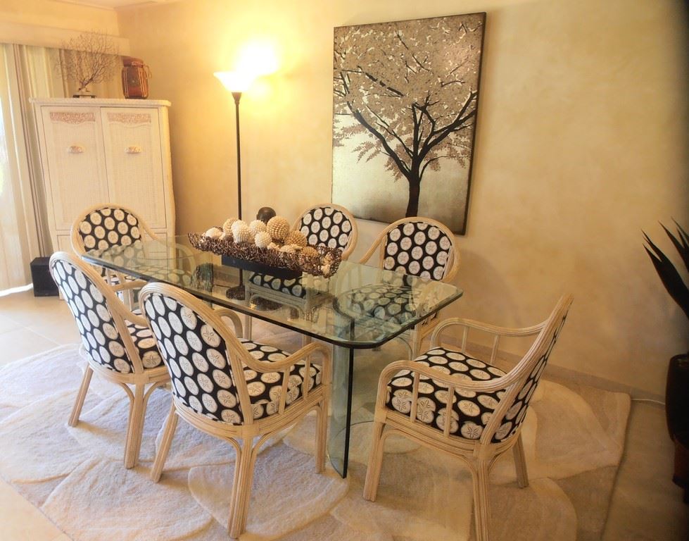 12 South Kihei Road, Unit G5 Kihei, HI 96753 - Photo 5 of 28 a view of a dining room with furniture and wooden floor