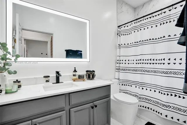 a bedroom with furniture a baby bed and a window