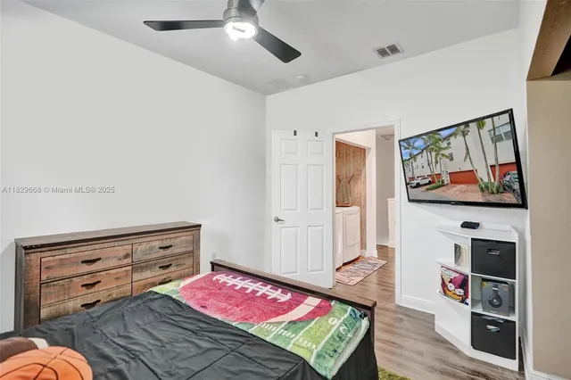 a view of a room with workspace and a window