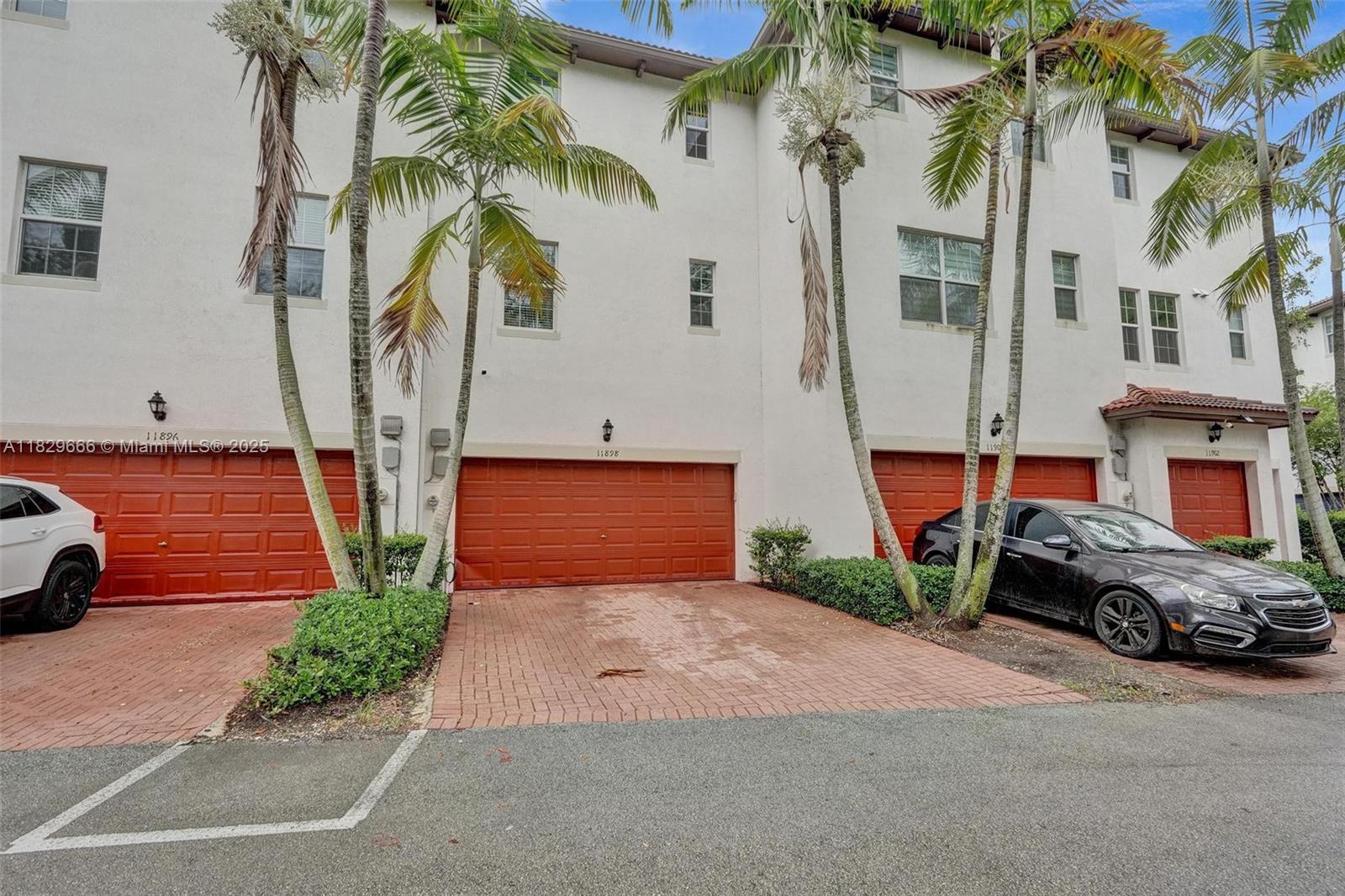 11898 Southwest 25th Court, Unit 103 Miramar, FL 33025 - Photo 35 of 40 2 car garage entrance