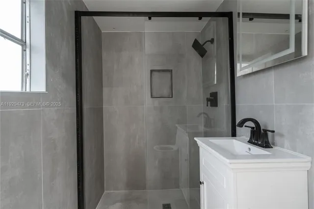 a bathroom with a sink and mirror