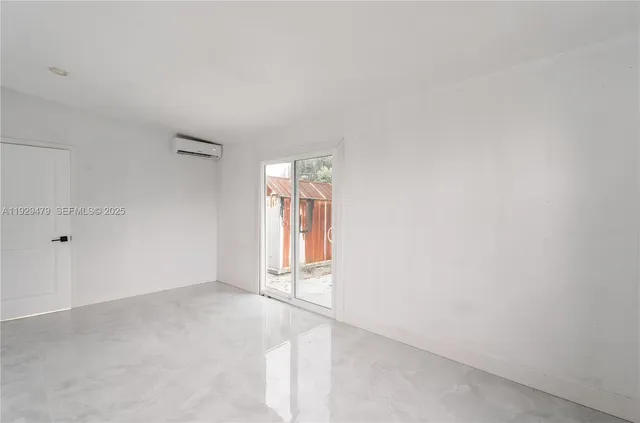 a view of an empty room and window