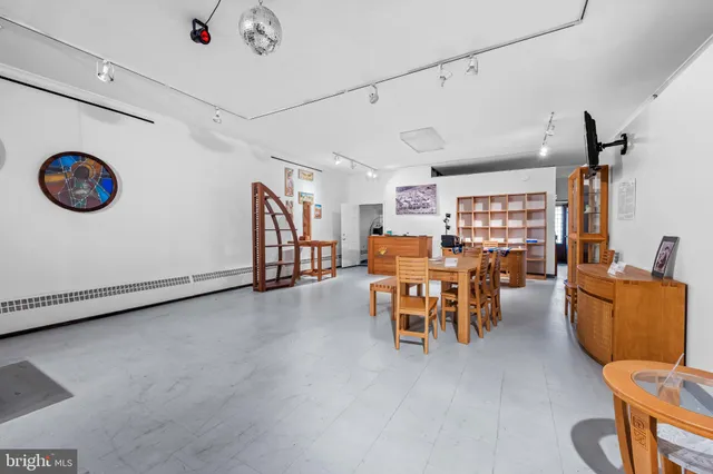 a dining room with furniture and a table