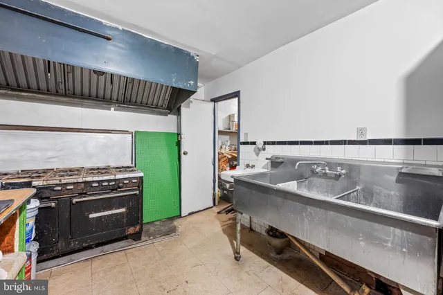 a kitchen with a stove and a sink