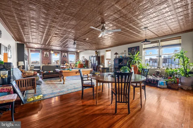 a living room with lots of furniture and a chandelier