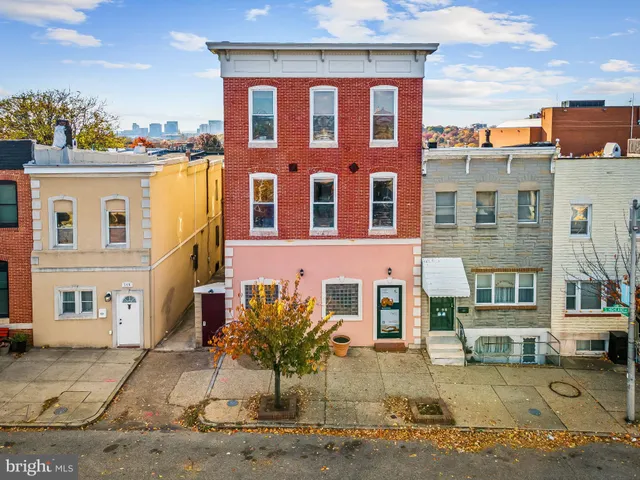 a front view of a building with many windows