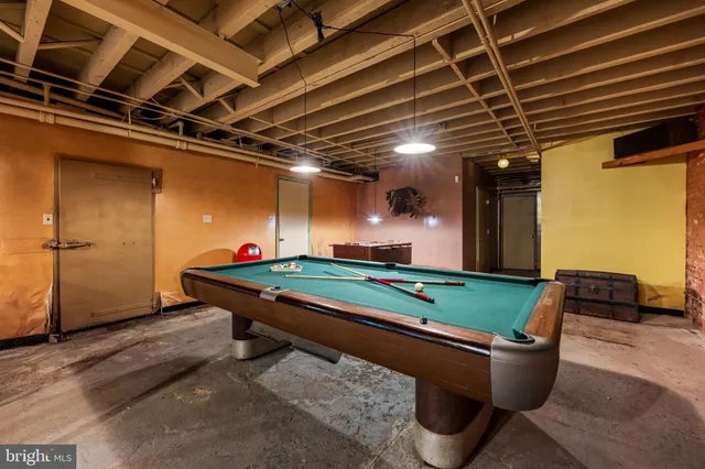 a room with furniture and a projector screen