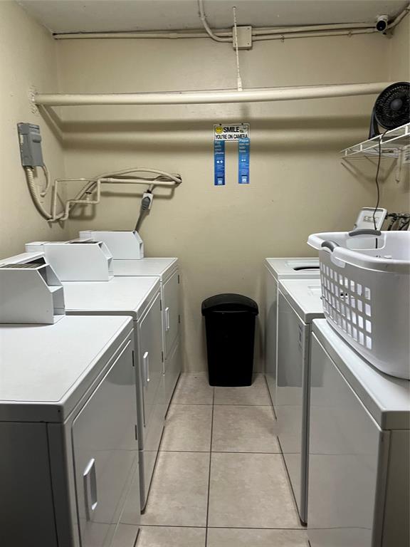 44 Southeast 14th Street, Unit 104 Boca Raton, FL 33432 - Photo 16 of 21 a utility room with a sink a washer and dryer