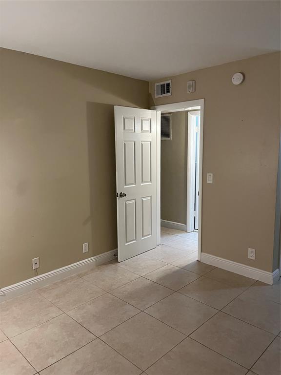 44 Southeast 14th Street, Unit 104 Boca Raton, FL 33432 - Photo 6 of 21 an empty room with a natural light