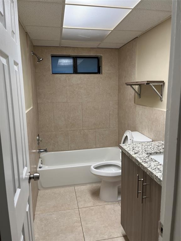 44 Southeast 14th Street, Unit 104 Boca Raton, FL 33432 - Photo 10 of 21 a bathroom with a granite countertop sink a toilet and shower