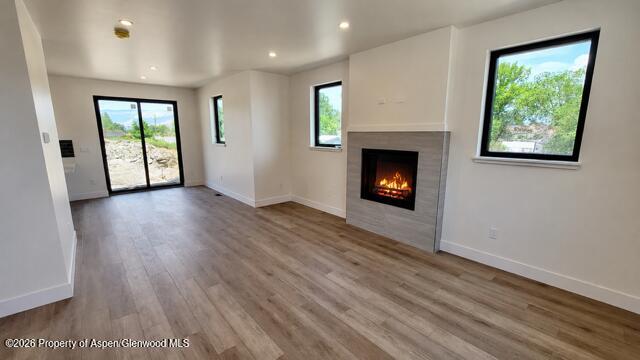511 Last Chance Drive Rifle, CO 81650 - Photo 6 of 14 an empty room with windows and fireplace